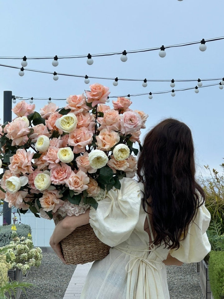 Flowers basket "First love" with roses and ranunculus