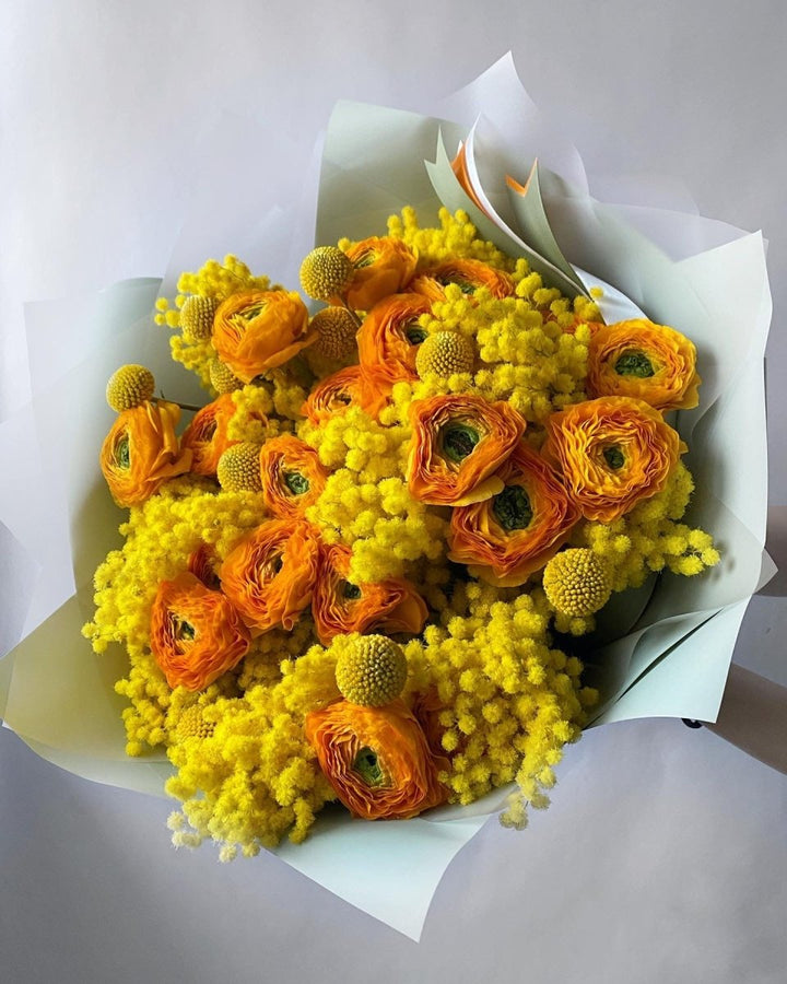 Bouquet of mimosa and ranunculus