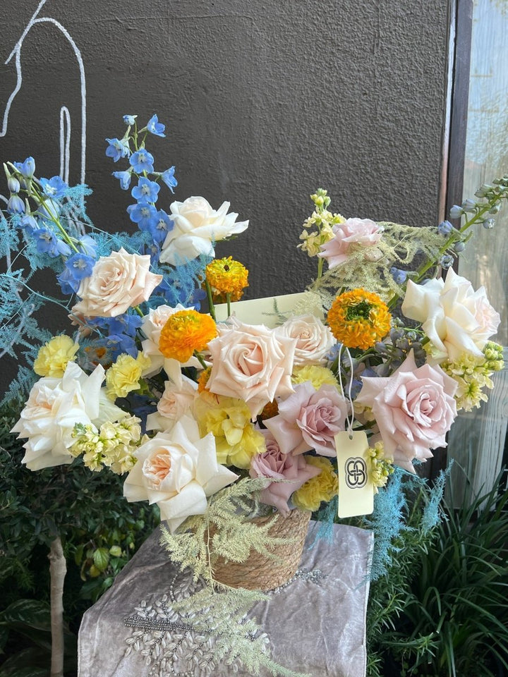 Flower basket "Lovely" with roses and tulips