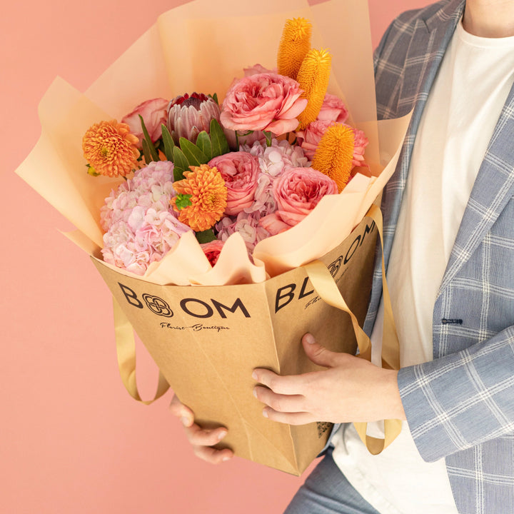 Bouquet "Sunset Serenade" with roses, ranunculus, hydrangea and mums