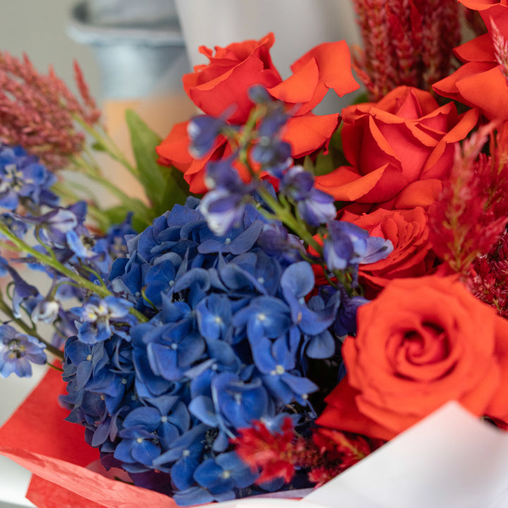 Bouquet "Moonlit Blooms" with red roses and blue hydrangea