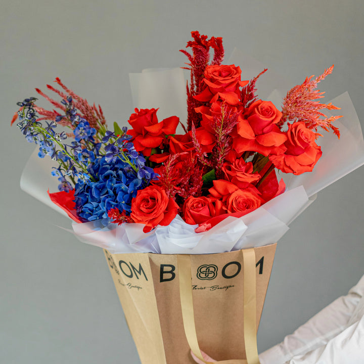 Bouquet "Moonlit Blooms" with red roses and blue hydrangea