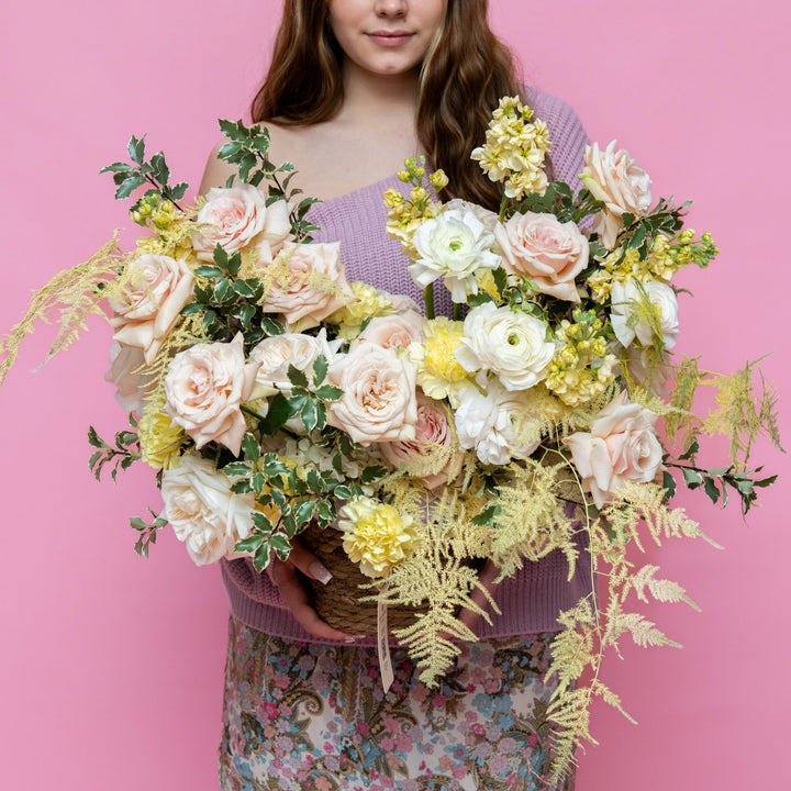 Flower basket "Sunny day" with roses and ranunculus