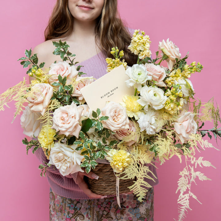 Flower basket "Sunny day" with roses and ranunculus