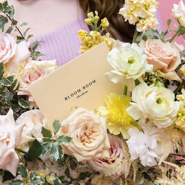 Flower basket "Sunny day" with roses and ranunculus