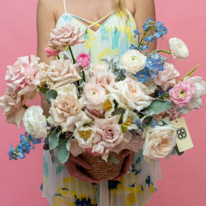 Flower basket "Foggy" with ranunculus and roses