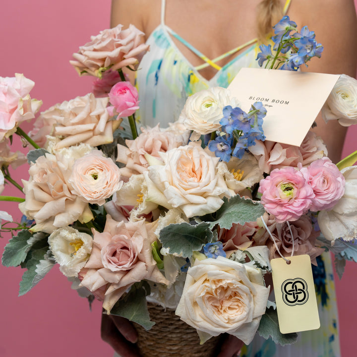 Flower basket "Foggy" with ranunculus and roses