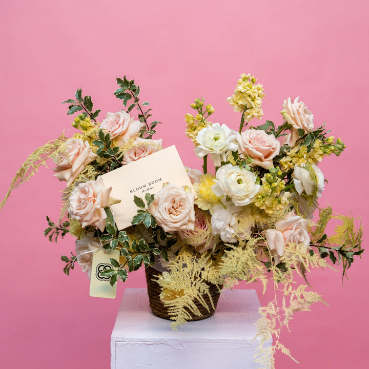 Flower basket "Sunny day" with roses and ranunculus