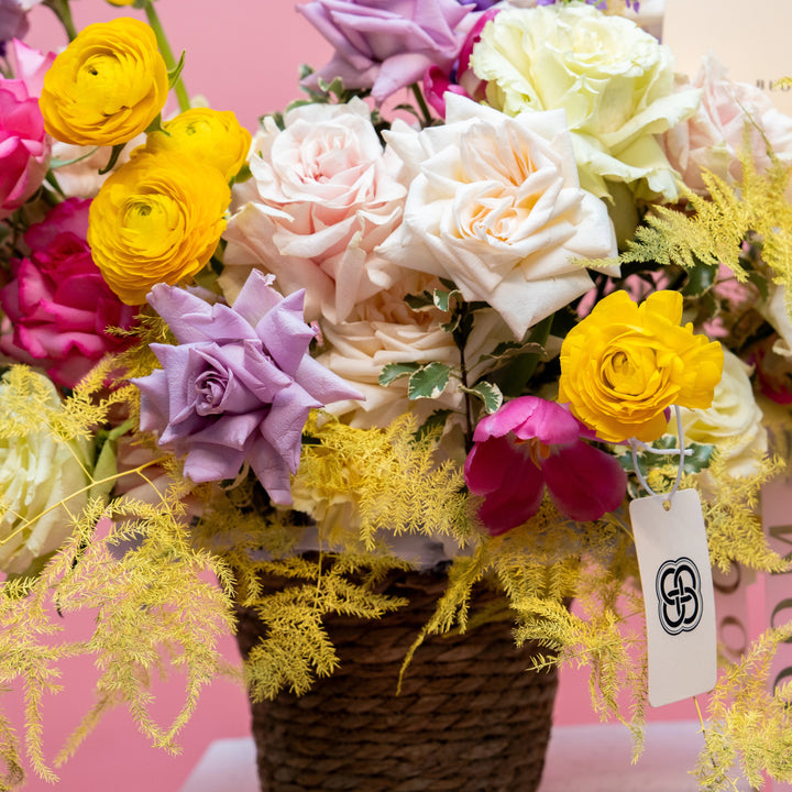 Flower basket "Spring Garden" with roses and tulips