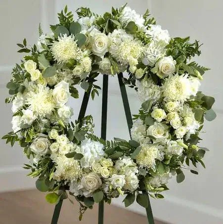 Premium floral sprays for $350 memorial services.