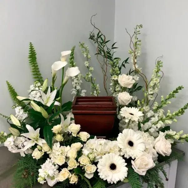 Elegant casket spray crafted with premium flowers for $350