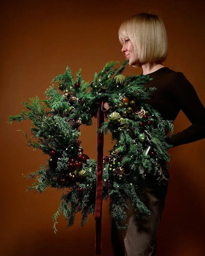 Festive holiday wreath in traditional colors